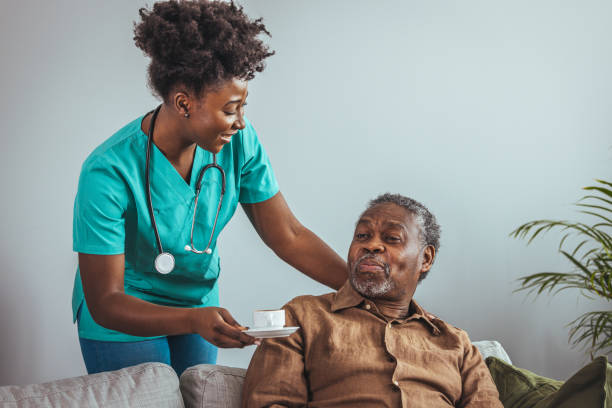 Caregiver serving tea to a senior client