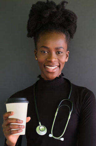 Friendly caregiver holding a cup of coffee